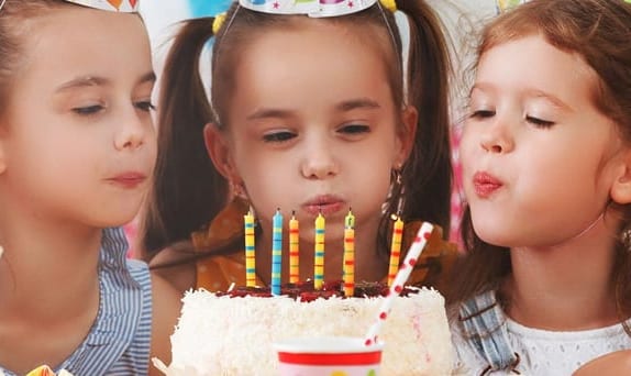 Children celebrating a birthday party at Bricks Studio